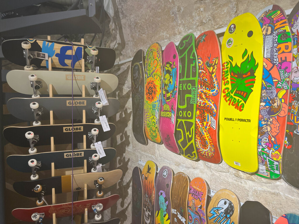 Painted skateboards hanging on wall