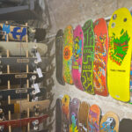 Painted skateboards hanging on wall